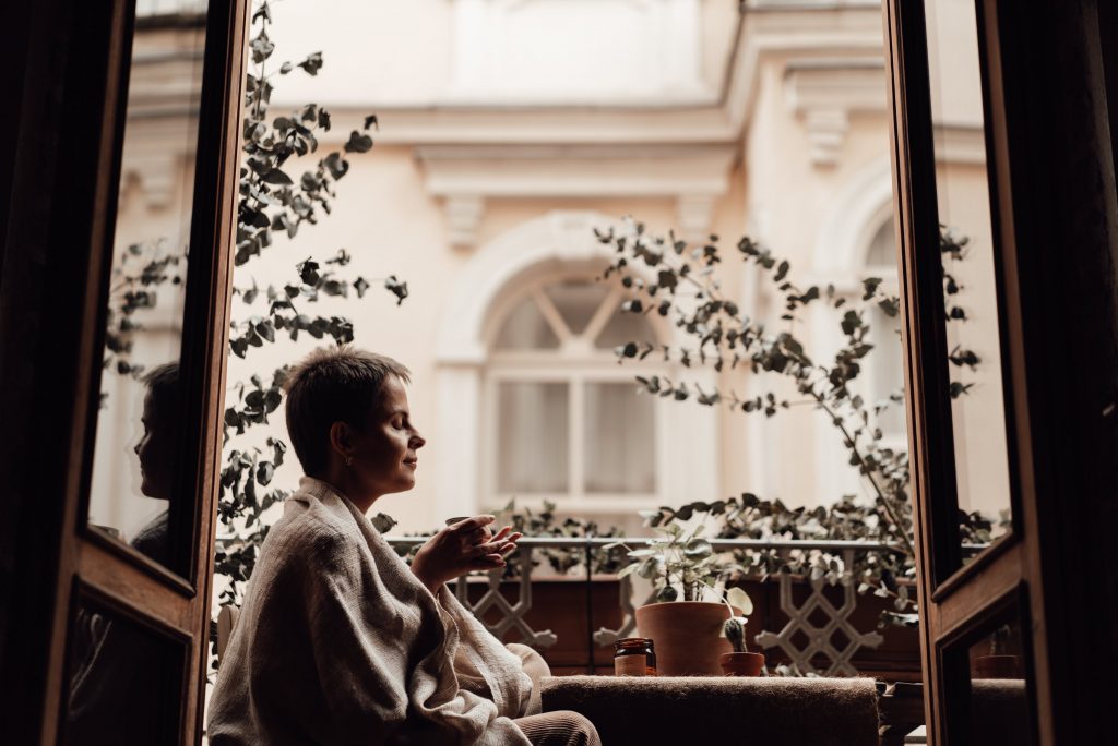 woman sitting on balcony